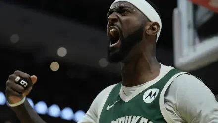 Bobby Portis Jr. passionately celebrates during a Milwaukee Bucks game, showcasing his intensity and dedication to the NBA. Vibrant HD wallpaper background ready for fans.