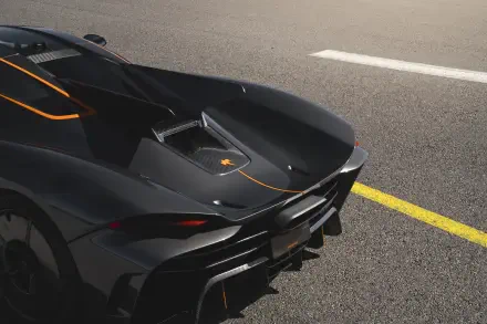 A striking Koenigsegg Jesko Absolut hypercar displayed on a smooth road, showcasing its sleek design and vibrant orange accents. 8K Ultra HD wallpaper.