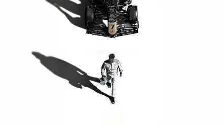 F1 (2025) 4K Ultra HD PC wallpaper: solitary driver in a race suit walking toward a black Formula 1 car on a stark white background, a long shadow cast behind.