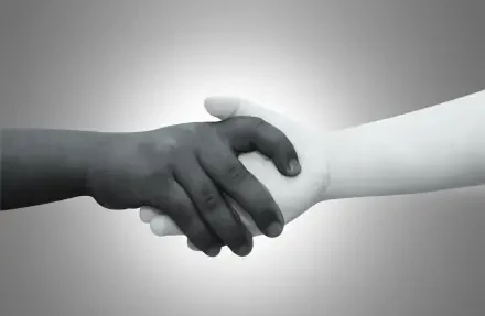 HD PC desktop wallpaper of two children's hands—one dark, one light—shaking in a simple handshake symbolizing peace and love.