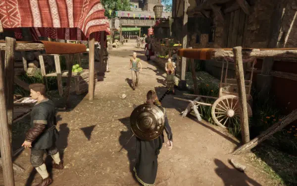 HD PC desktop wallpaper from the video game The Quinfall, showing a medieval market street scene with characters walking among wooden stalls and buildings.