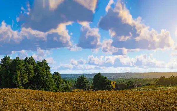 Kingdom Come: Deliverance II 5K Ultra HD PC desktop wallpaper showing a sunlit medieval countryside: golden field, tree line and distant village beneath a blue sky with fluffy clouds.