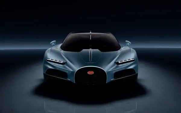 A sleek Bugatti Tourbillon hypercar showcased in a stunning 4K Ultra HD image, highlighting its aerodynamic design against a dark backdrop.