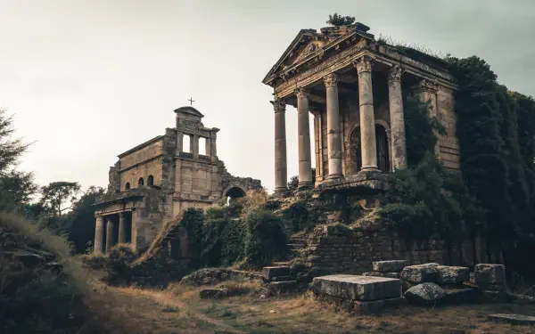 An evocative image of ancient ruins surrounded by overgrown vegetation, showcasing majestic pillars and stone structures, designed as a 4K Ultra HD PC desktop wallpaper.