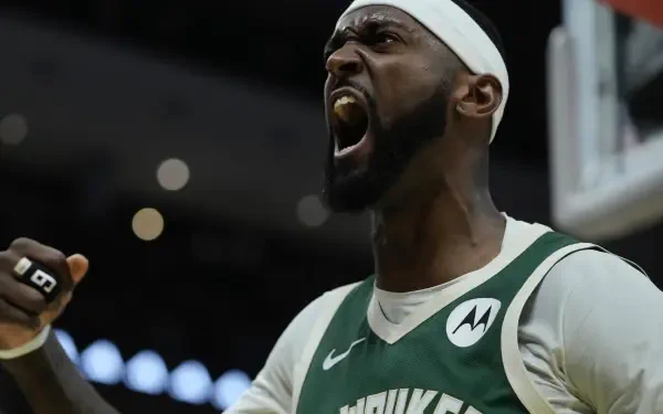 Bobby Portis Jr. passionately celebrates during a Milwaukee Bucks game, showcasing his intensity and dedication to the NBA. Vibrant HD wallpaper background ready for fans.