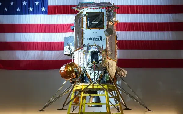 A detailed image of an Intuitive Machines lunar lander against a backdrop of the American flag, showcasing a blend of technology and patriotism in a high-definition desktop wallpaper.