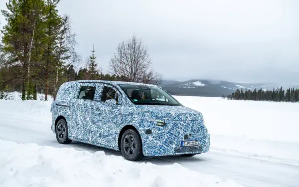 Mercedes-Benz MPV in camouflage driving through snowy landscape, captured in 8K Ultra HD for PC desktop wallpaper and background use.