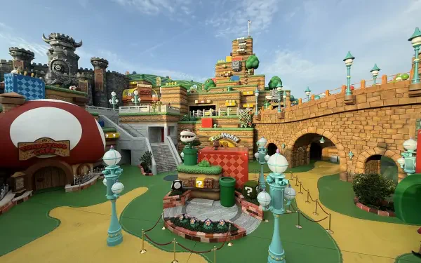 HD PC desktop wallpaper showcasing the colorful, detailed Super Nintendo World area at Universal Studios with vibrant-themed buildings and pathways under a clear sky.