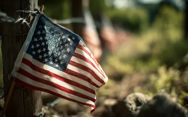 HD PC desktop wallpaper featuring an American flag hanging outdoors, symbolizing Memorial Day and honoring the holiday.