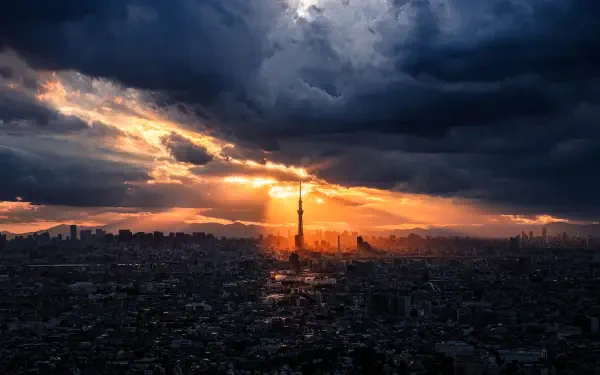 Tokyo cityscape with dramatic sunlight rays breaking through dark clouds, captured in stunning 8K Ultra HD photography for a vivid PC desktop wallpaper.