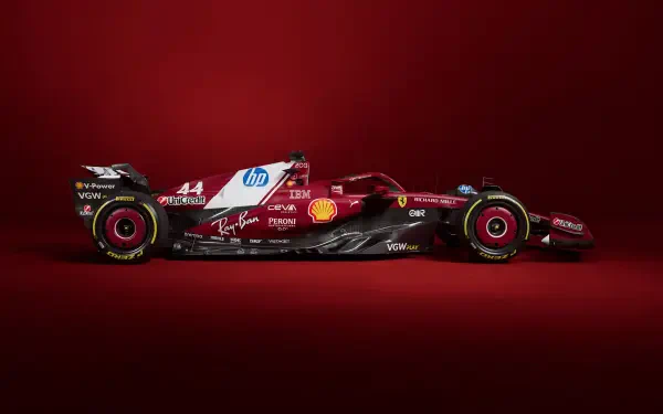Side view of a red Ferrari SF-25 F1 car against a matching red background, captured in stunning 4K Ultra HD for a sleek PC desktop wallpaper.