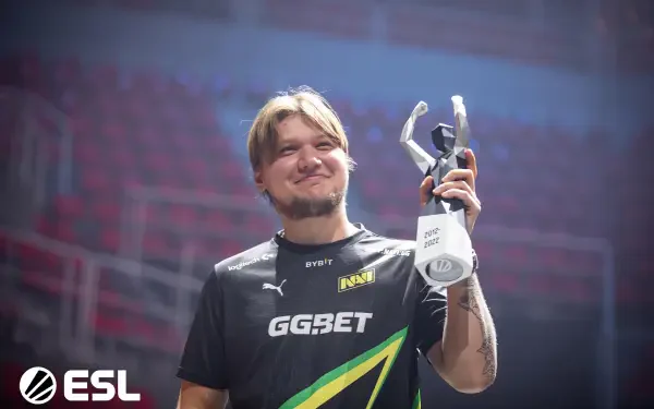 HD esports desktop wallpaper featuring s1mple from Natus Vincere holding a trophy, captured in a celebratory moment at an ESL event.