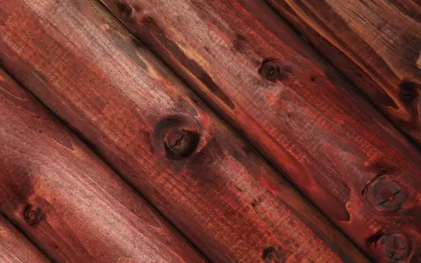 HD PC desktop wallpaper and background: close-up of red-stained wooden planks with pronounced grain and knots creating a rustic wall texture.
