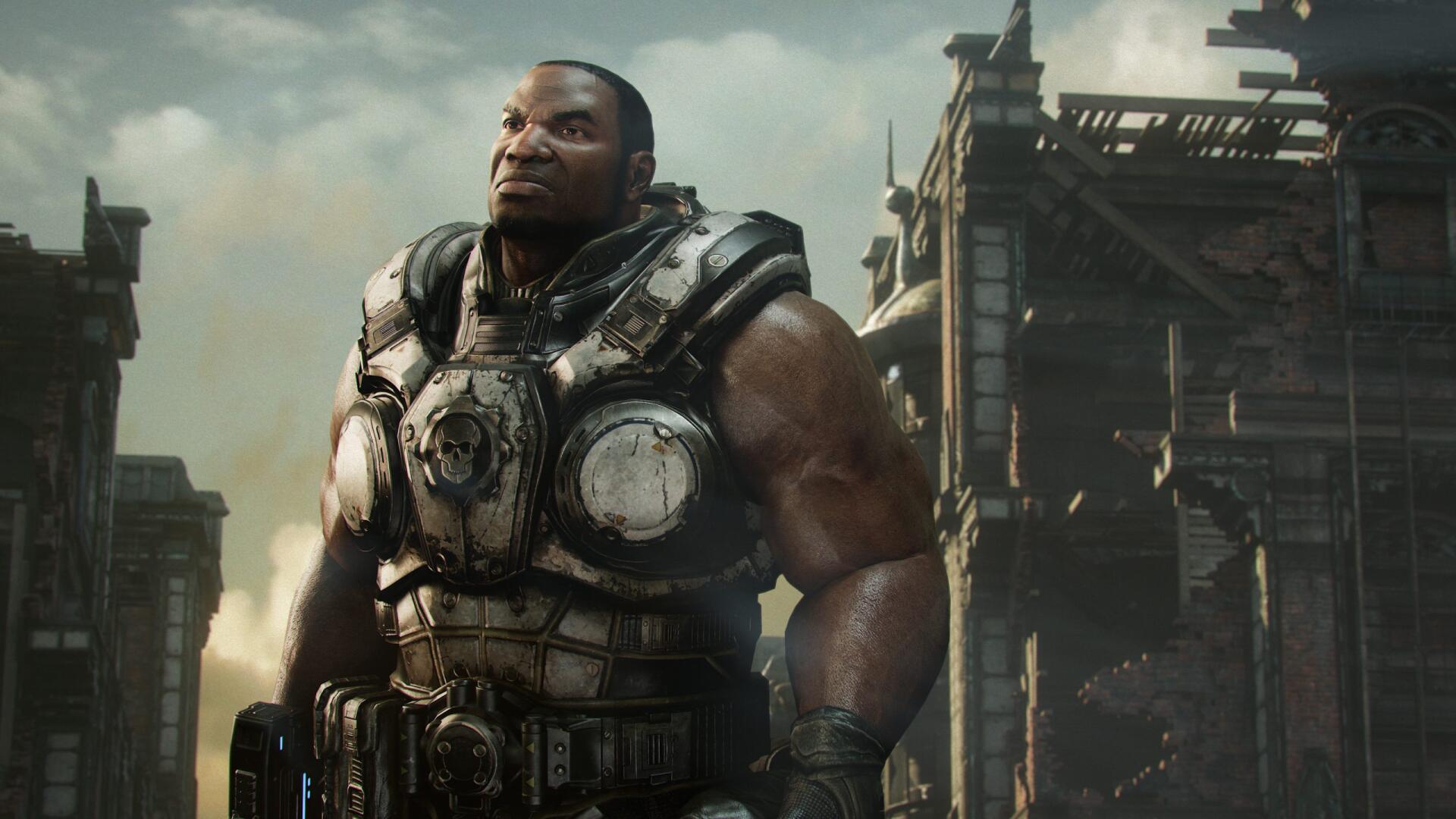 HD PC desktop wallpaper and background from the video game Gears Of War: Reloaded — a heavily armored soldier stands amid a ruined industrial skyline.