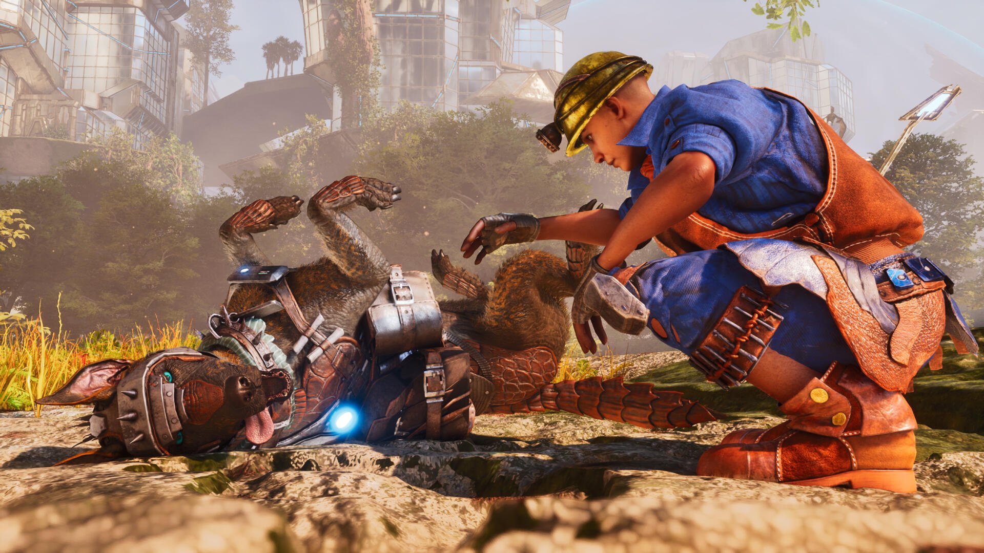 HD PC desktop wallpaper background from the video game Ark 2: a crouching mechanic tending to a disabled robotic creature amid sunlit, overgrown urban ruins.