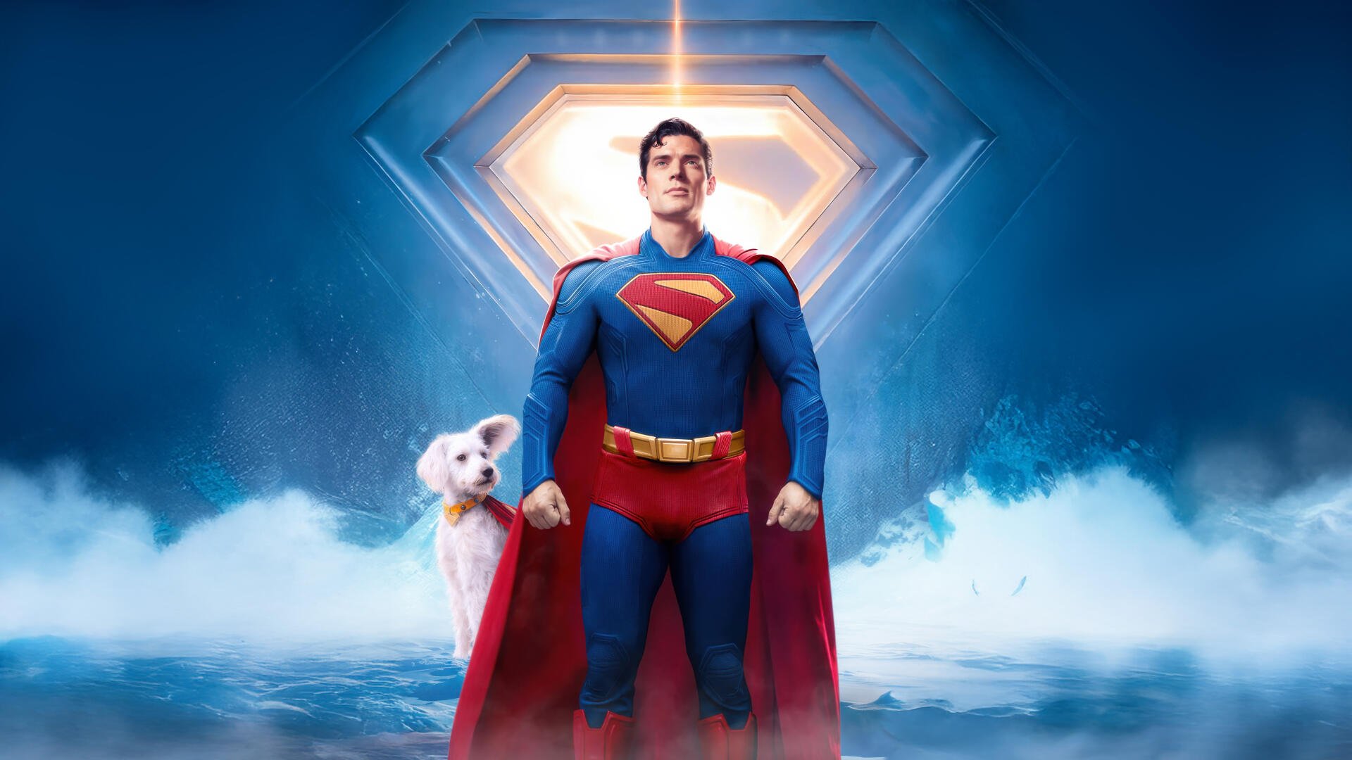 8K Ultra HD PC desktop wallpaper: Superman (2025) stands heroically before a glowing emblem, Krypto the dog at his side.