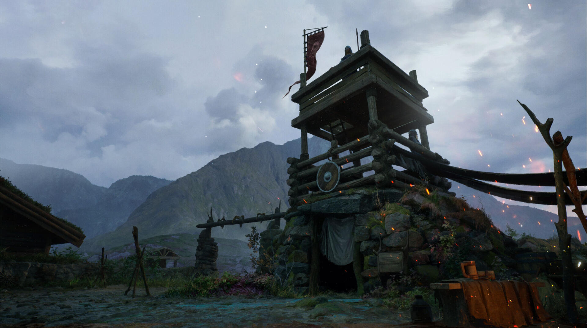 HD PC desktop wallpaper from the video game NORSE: Oath of Blood showing a weathered wooden watchtower before misty mountains and a stormy sky.