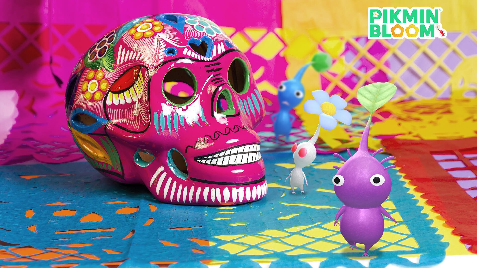 HD PC desktop wallpaper of Pikmin: small colorful Pikmin exploring a bright patterned scene next to a decorated sugar skull, with the Pikmin Bloom logo in the corner.