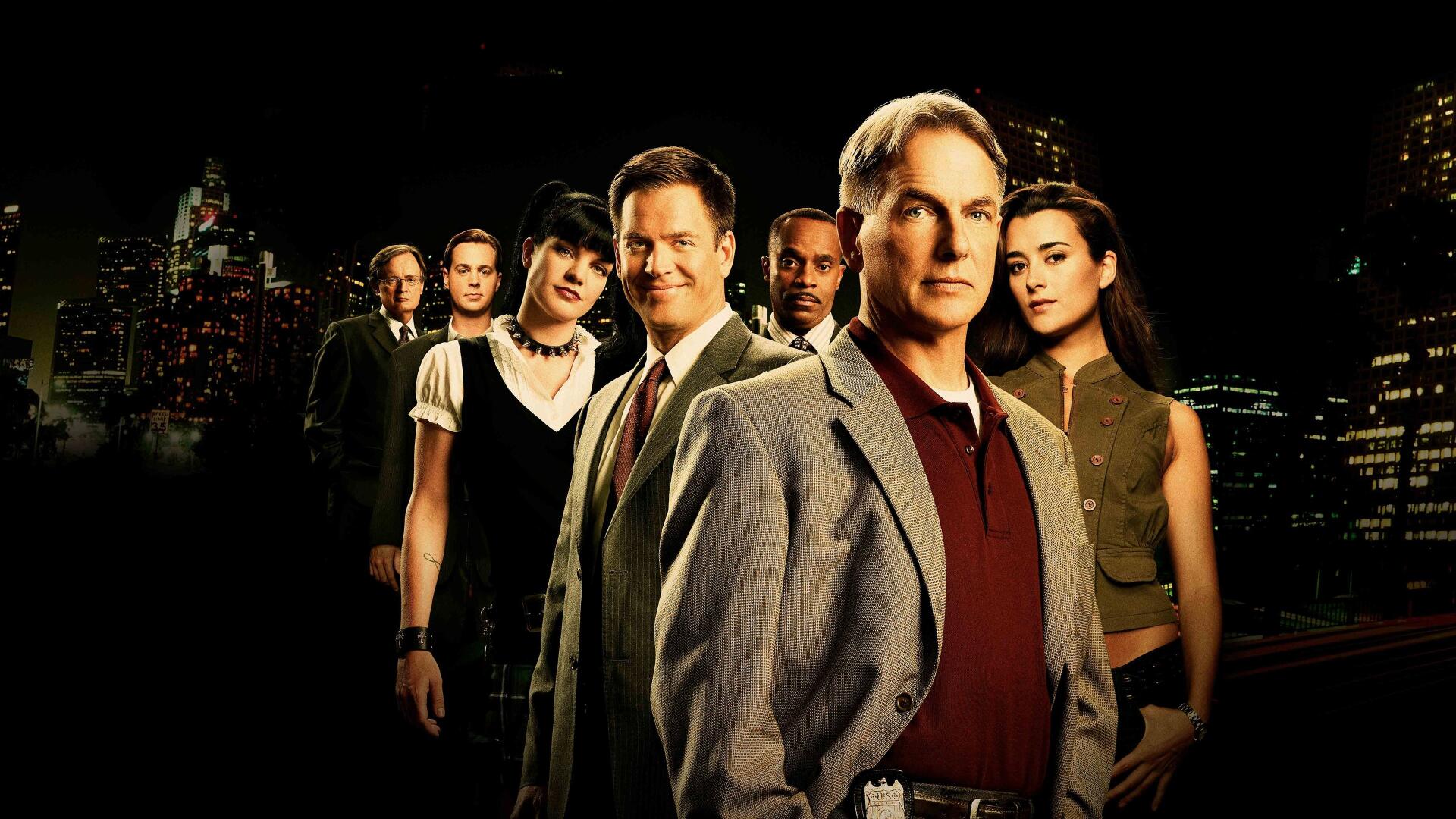 NCIS ensemble portrait against a nighttime city skyline — 4K Ultra HD PC desktop wallpaper/background.