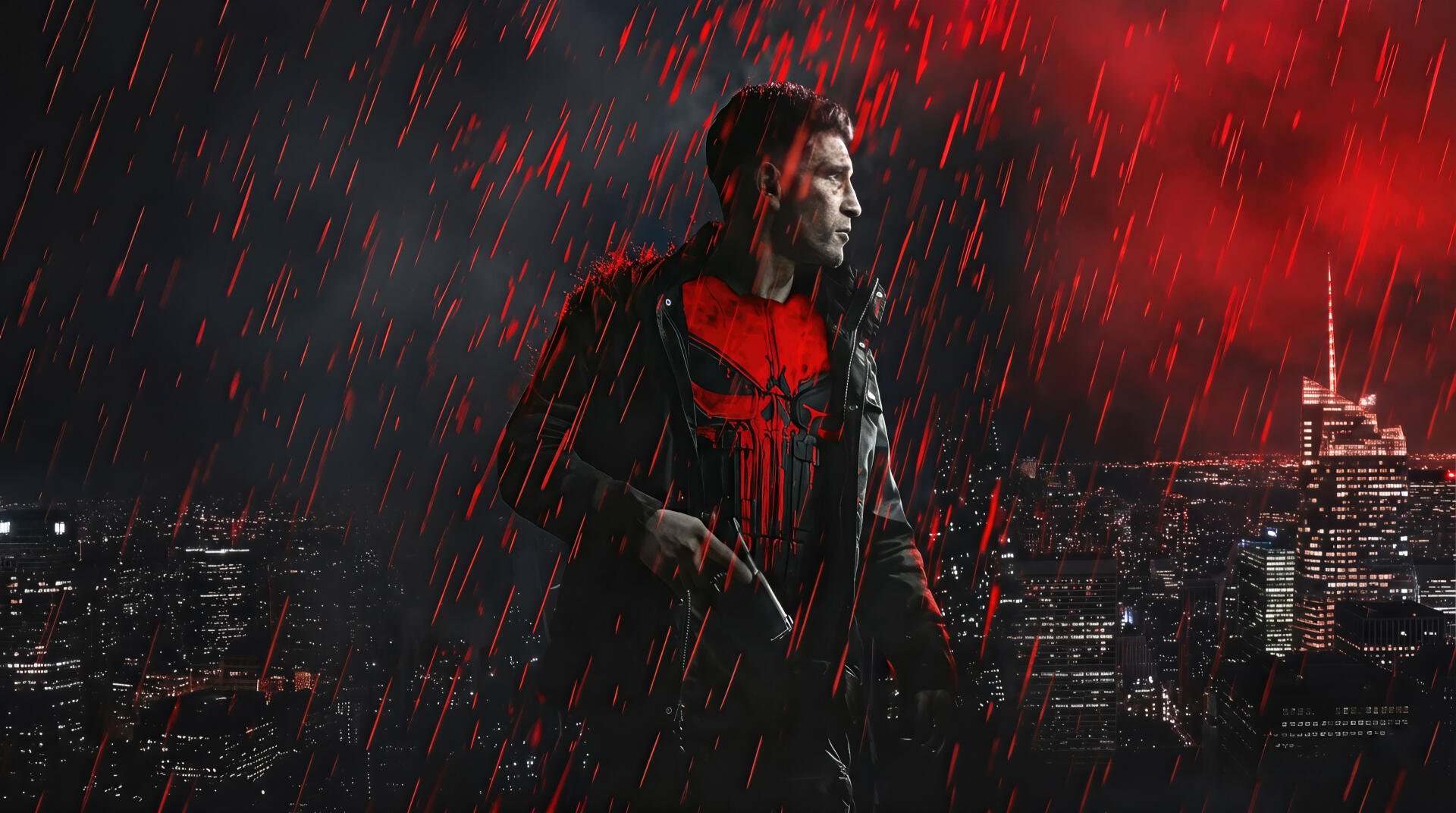 Punisher in rain, red skull emblem glowing on his chest against a dark city skyline — 2K Quad HD PC desktop wallpaper/background.