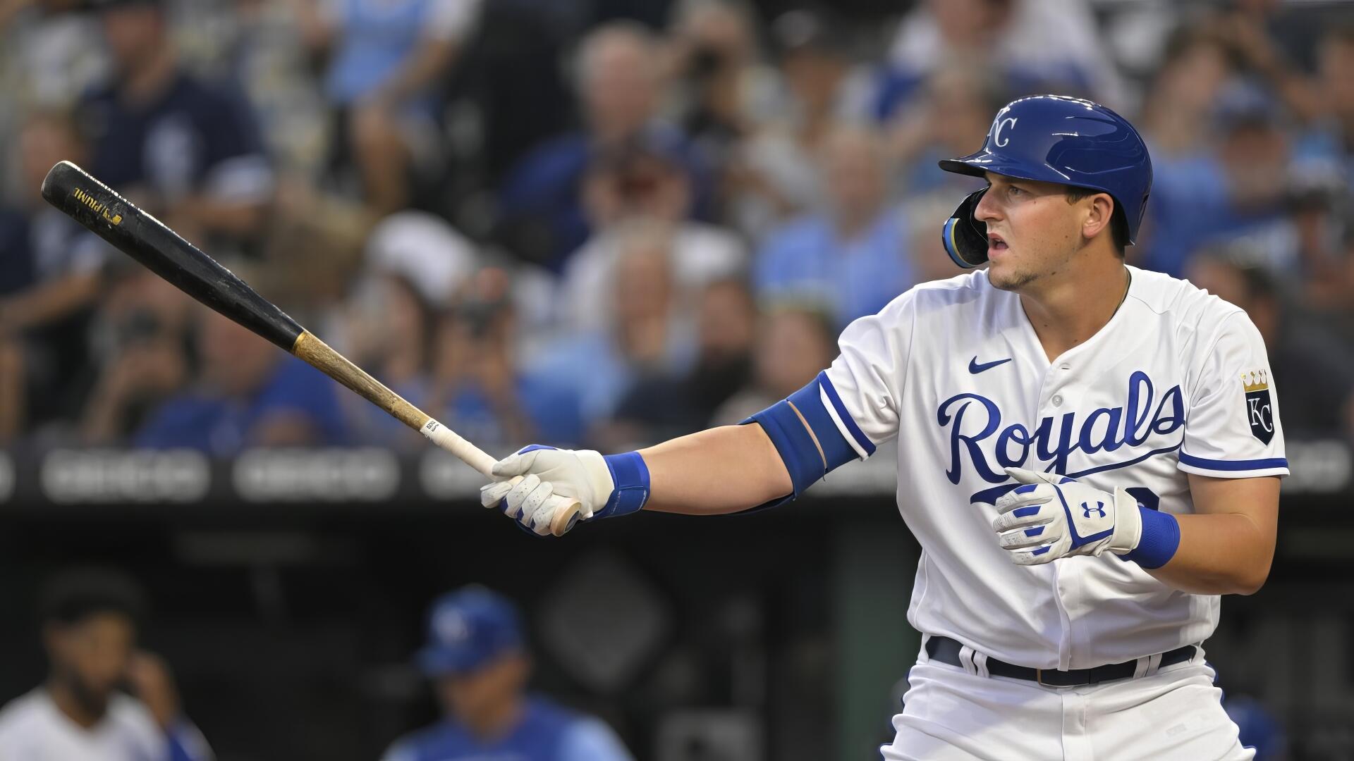 HD PC desktop wallpaper of a Kansas City Royals batter in white uniform swinging a bat with a blurred crowd behind him.