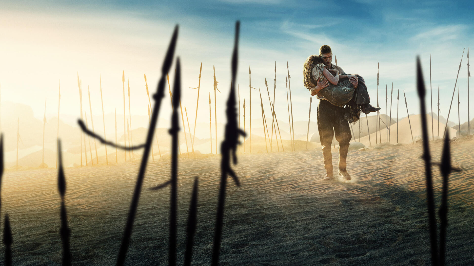 The Wheel of Time 4K Ultra HD PC desktop wallpaper: lone rider carrying another across a foggy, spear-studded desert, tall spears silhouetted against a blue, windblown sky.