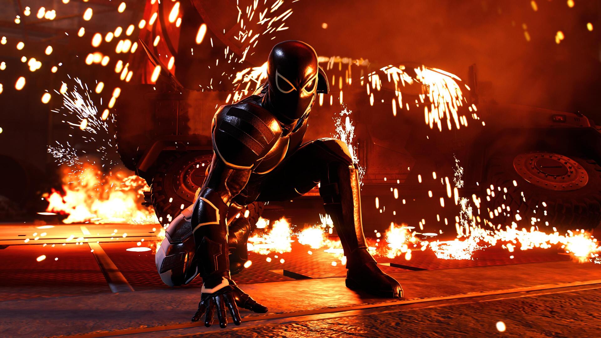 Spider-Man (PS4) in a black suit crouches on a fiery street surrounded by sparks and flames — 4K Ultra HD video game PC desktop wallpaper/background.