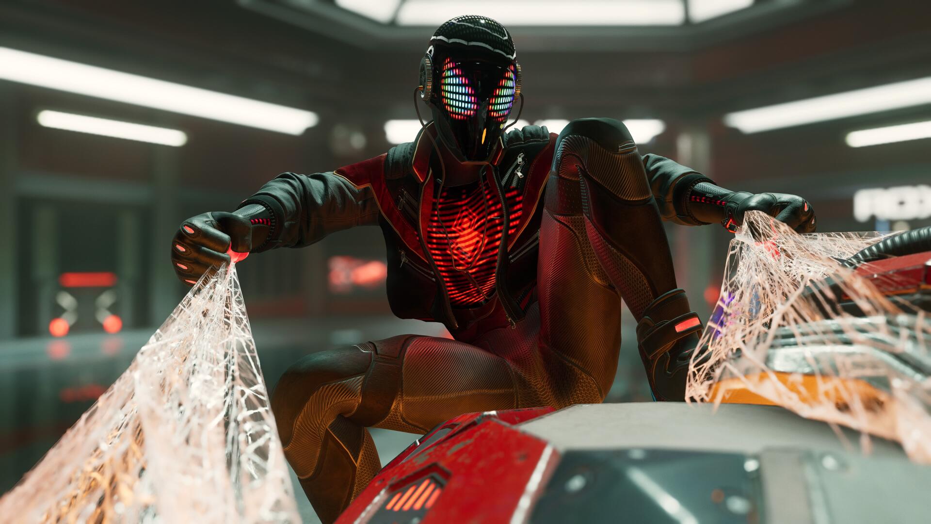 Video game 4K Ultra HD PC desktop wallpaper: Spider-Man (PS4) in a red-black armored suit crouches on a tech rooftop, chest glowing and webbing flaring in cinematic lighting.