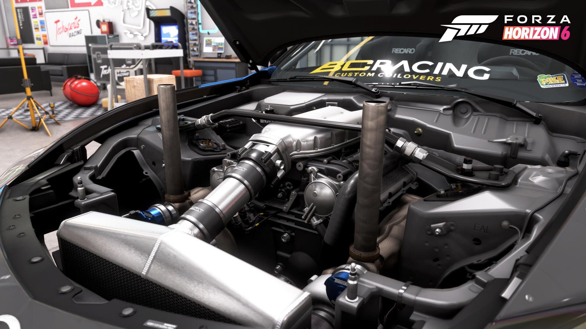 Close-up of a modified racing engine bay with turbo piping and a Forza Horizon 6 logo — 4K Ultra HD PC desktop wallpaper for the video game.