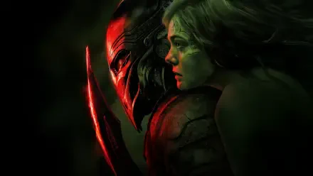 Predator: Badlands 5K Ultra HD PC desktop wallpaper — close-up of a masked Predator with glowing red blades beside a tense woman in dark green lighting.