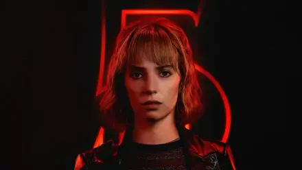 Stranger Things 5K Ultra HD PC wallpaper: red-lit young woman with short hair staring ahead against a large neon '5' on a dark background.
