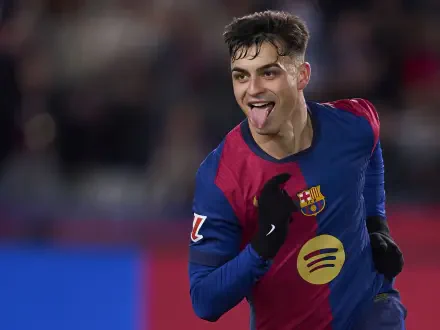 HD PC desktop wallpaper of a jubilant FC Barcelona soccer player celebrating on the pitch, wearing club colors and pointing while sticking out his tongue.