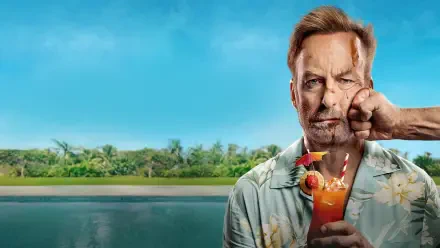 Nobody 2 4K Ultra HD PC desktop wallpaper: bruised man in a Hawaiian shirt sips a cocktail with an umbrella as a fist presses his cheek, tropical beach and blue sky behind him.