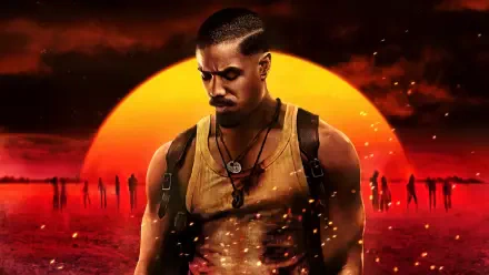 Sinners — muscular man in a tank top and pendant stands before a blazing red sunset, shadowy figures on a fiery plain. 4K Ultra HD PC desktop wallpaper and background.