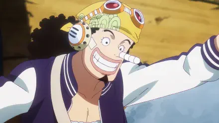 Anime One Piece HD PC desktop wallpaper/background: Usopp grinning in goggles and helmet, arm outstretched against a sandy backdrop.
