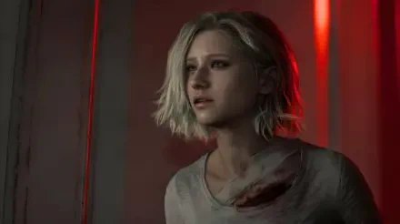 Grace Ashcroft from Resident Evil Requiem (Capcom), bloodstained and bathed in red light — 5K Ultra HD PC desktop wallpaper/background, horror video game scene.