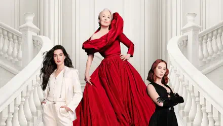 The Devil Wears Prada 2 — 2K Quad HD PC desktop wallpaper: three elegant women on a sweeping white staircase; center in a voluminous red gown, flanked by figures in white and black.
