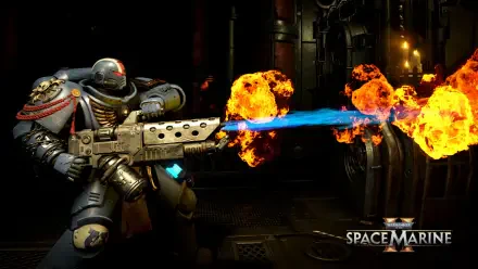 4K Ultra HD PC desktop wallpaper: video game Warhammer Space Marine firing a blue flame weapon amid fiery explosions in a dark industrial sci‑fi corridor, Space Marine logo at bottom right.
