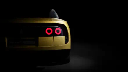 Rear view of a yellow Ferrari Luce with glowing twin round taillights in deep shadow — 4K Ultra HD PC desktop wallpaper/background.