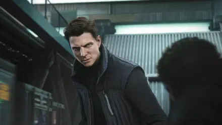 HD PC desktop wallpaper from the video game 007: First Light — brooding James Bond in a dark jacket, tense expression as he leans forward in an industrial, dimly lit interior.