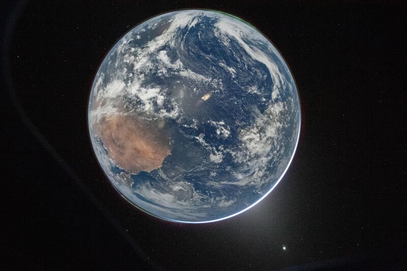 {{ Earth from space 5K Ultra HD PC desktop wallpaper/background: sunlit Africa, swirling clouds and a bright atmospheric limb against the blackness of space. 
