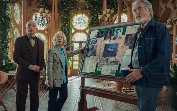 4K Ultra HD PC desktop wallpaper from the movie The Thursday Murder Club: three older adults gathered around a pinned evidence board in a cozy, sunlit room.