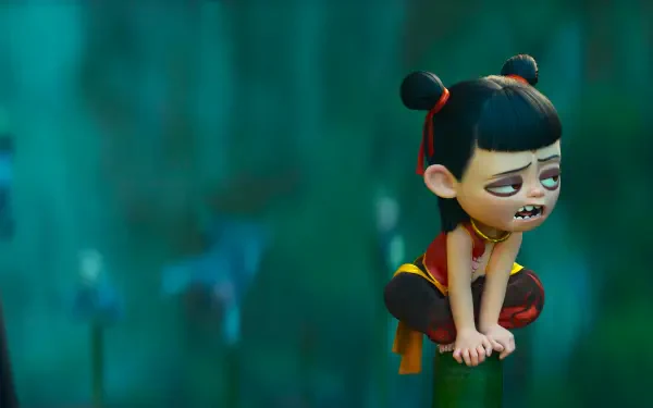 Anime movie Ne Zha character crouches atop a pole with a weary face against a teal blurred backdrop — 2K Quad HD PC desktop wallpaper/background.