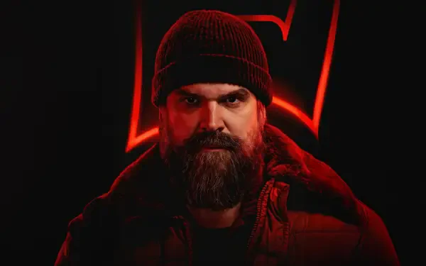 Stranger Things 4K Ultra HD PC desktop wallpaper: bearded man in knit cap and coat, lit by red neon '5' emblem against a dark background.