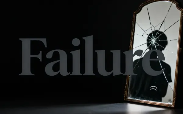 4K Ultra HD PC desktop wallpaper showing the word Failure across a dark room with a cracked mirror reflecting a shadowy silhouette.
