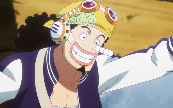 Anime One Piece HD PC desktop wallpaper/background: Usopp grinning in goggles and helmet, arm outstretched against a sandy backdrop.