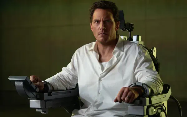 4K PC wallpaper for Mercy (2026): tense scene of a man in a white shirt strapped to a medical restraint chair in a dim lab; actor not identified.