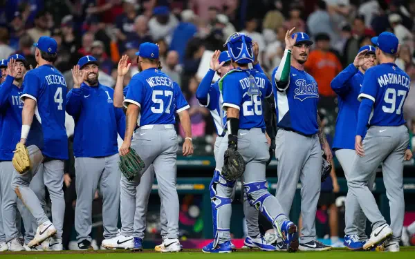 World Baseball Classic team in blue uniforms exchanging high-fives on the field — sports action, 8K Ultra HD PC desktop wallpaper and background.