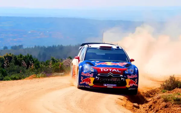 2K Quad HD PC desktop background: Citroën DS3 WRC race car tearing down a dusty dirt stage, WRC livery and sponsor logos visible.