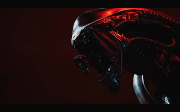 Close-up of a glossy biomechanical alien head in red light from a video game — 4K Ultra HD PC desktop wallpaper/background.